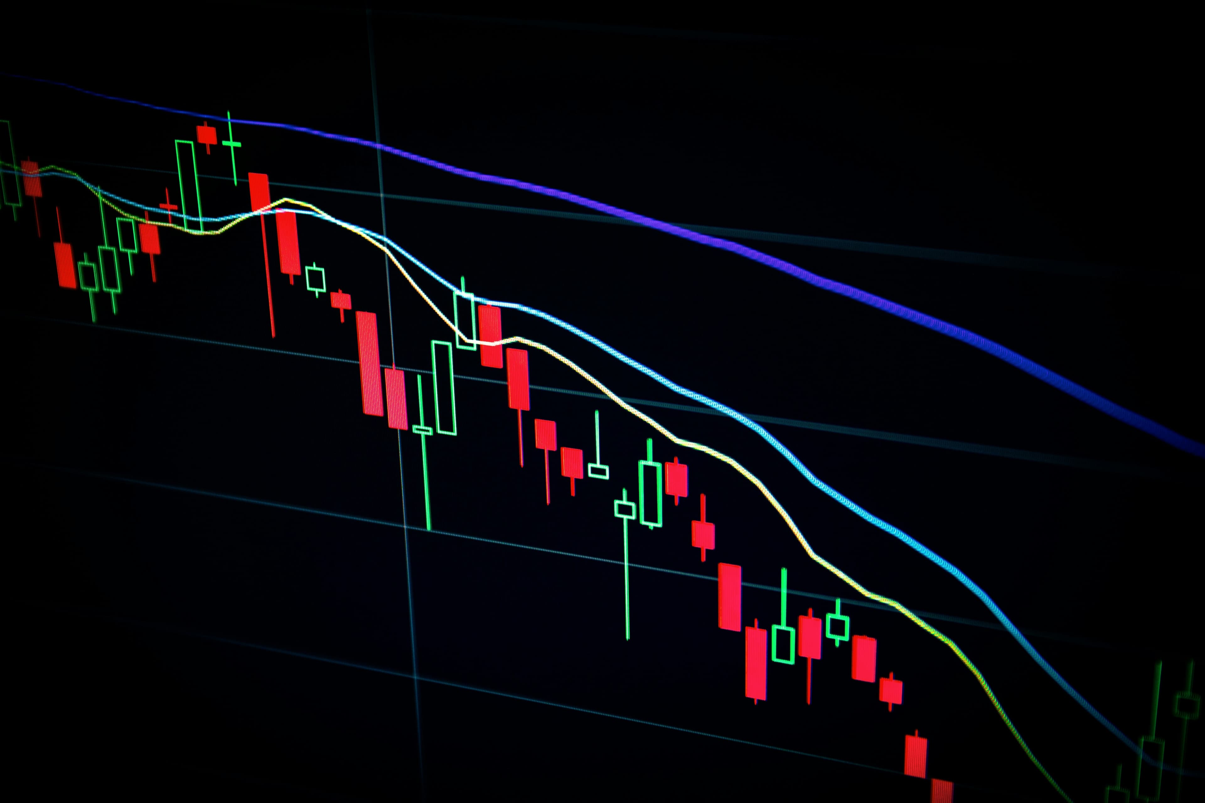 Stock market trading screens showing rising indices