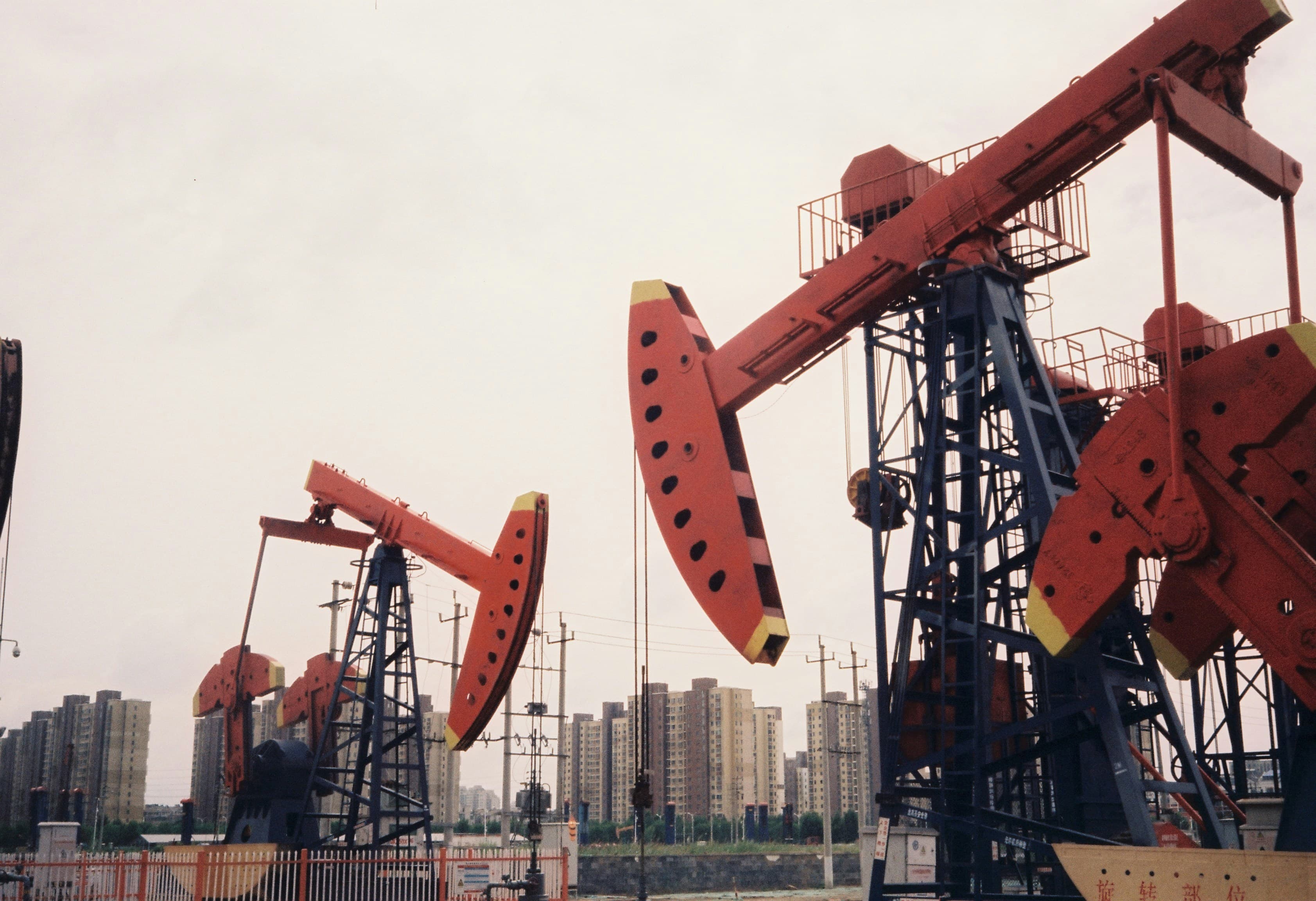 An oil refinery, symbolizing global energy infrastructure and trade.